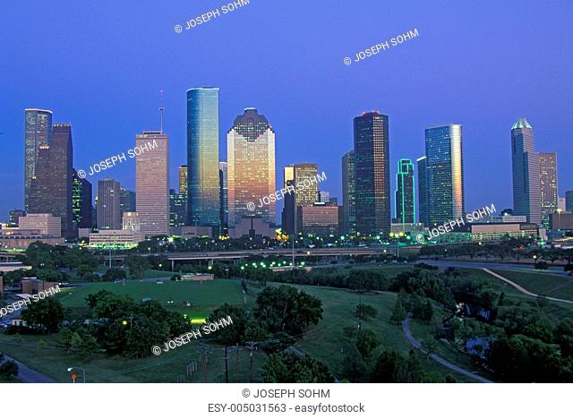 Houston, TX skyline with Memorial Park in foreground at dusk