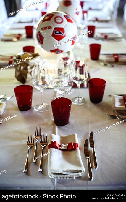 Cutlery and napkin noodle and ceramic heart above table set for wedding