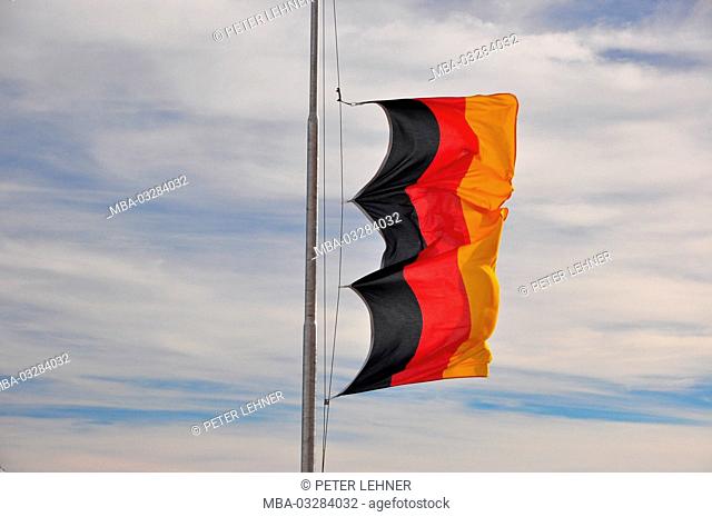 German flag, pole, storm, flapping