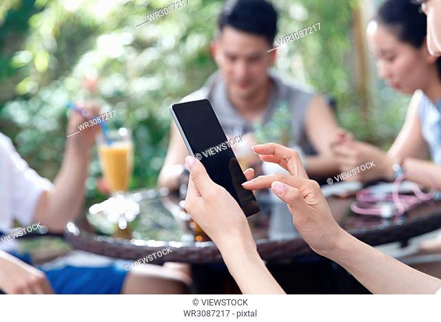 Young people watch mobile phones