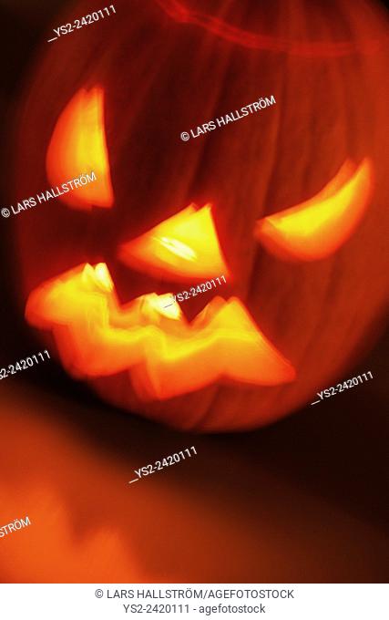 Illuminated halloween pumpkin. Long exposure creating a blurred effect