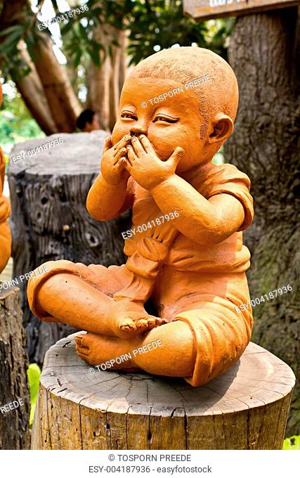 statue of a cute little monk