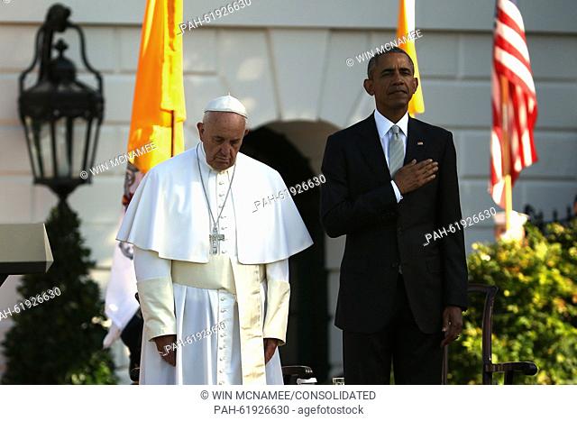 (L-R) Pope Francis and U.S. President Barack Obama stands for the national anthem of the United States during the arrival ceremony at the White House on...