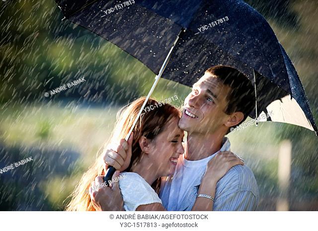 Couple in love in the rain
