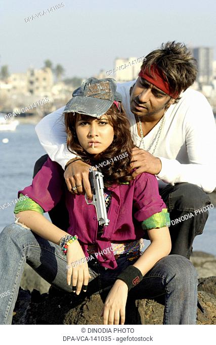 Bollywood film actor Ajay Devgan and Nisha Kothari in movie Ram Gopal Varma ki Aag NO MR