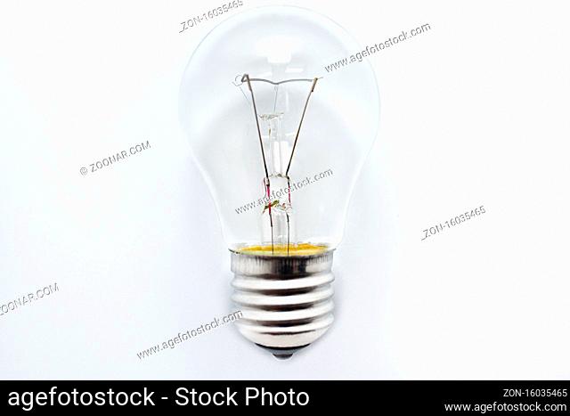 one incandescent bulb lying on white