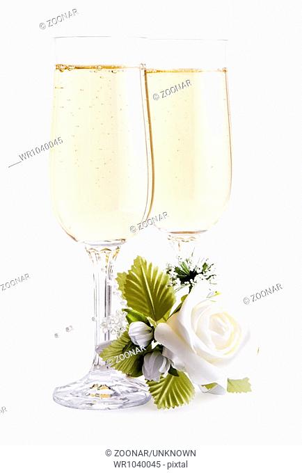 two glasses of champagne and bouquet flowers
