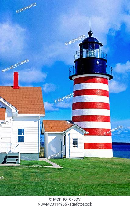 west quoddy head lighthouse was commissioned in 1808 by president thomas jefferson and rebuilt in 1858 - maine, USA