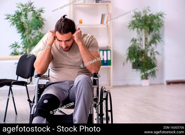 Young leg injured man in the wheel-chair