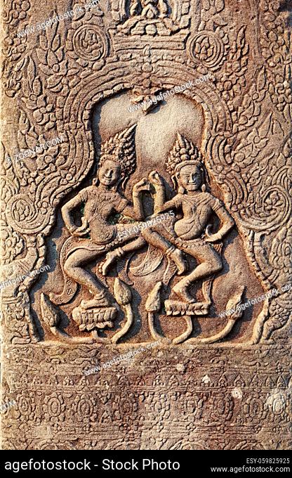Historic Khmer bas-relief showing dancing Hindu goddesses, Cambodia