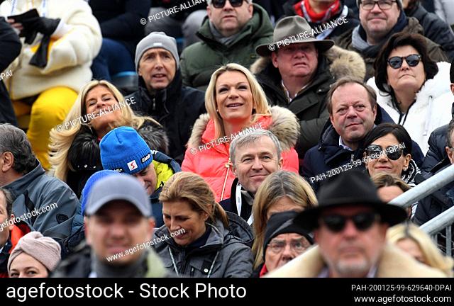 25 January 2020, Austria, Kitzbühel: Former ski racer Maria Höfl-Riesch (m) watches the men's downhill race on the Streif from the grandstand in the finish area...