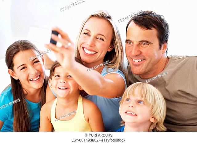 Portrait of happy family with children taking self portrait