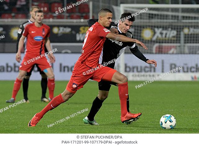Heidenheim's Robert Glatzel (L) and Kaiserslautern's Christoph Moritz vie for the ball during the German 2nd division Bundeliga soccer match between 1