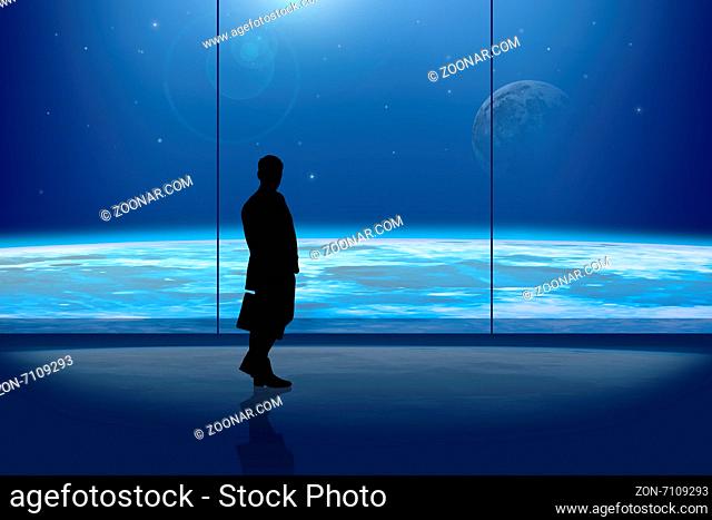 Businessman in front of the window at night