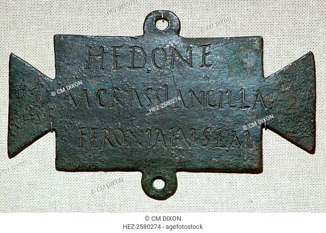 Roman bronze plaque with a dedication to Feronia, a goddess worshipped by freedmen and freedwomen. This plaque was dedicated in fulfillment of a vow by Hedone