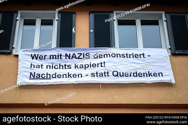 22 January 2022, Baden-Wuerttemberg, Stuttgart: ""Who demonstrates with Nazis has nothing understood! Think instead of thinking outside the box"" is written on...