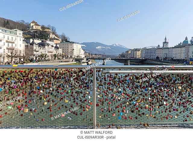 View of love locks on waterfront fence, Salzburg, Austria