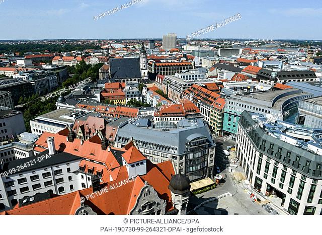 25 July 2019, Saxony, Leipzig: Panoramic view from the tower of the New Town Hall to the city centre of Leipzig with the Burgplatz, the Burgstraße