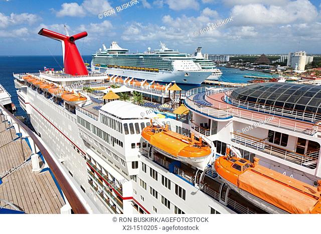 Carnival Ecstacy and two Royal Caribbean cruize ships at port in Cozumel, Mexico in the Caribbean Sea
