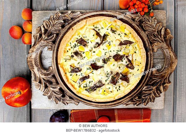 Top view of quiche lorraine in autumn setting