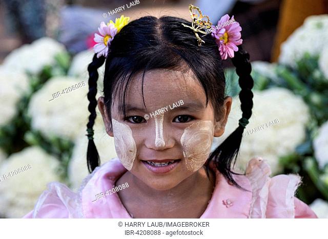 Local girl with braids and Thanka paste on her face, portrait, Mandalay Division, Bagan, Mandalay Division, Myanmar