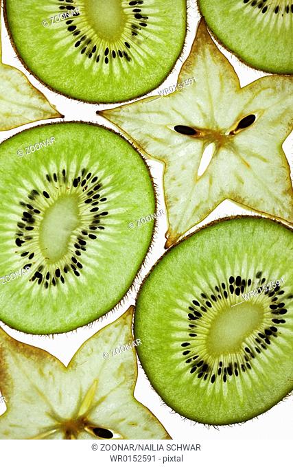 Sliced Kiwifruit and Starfruit isolated on white
