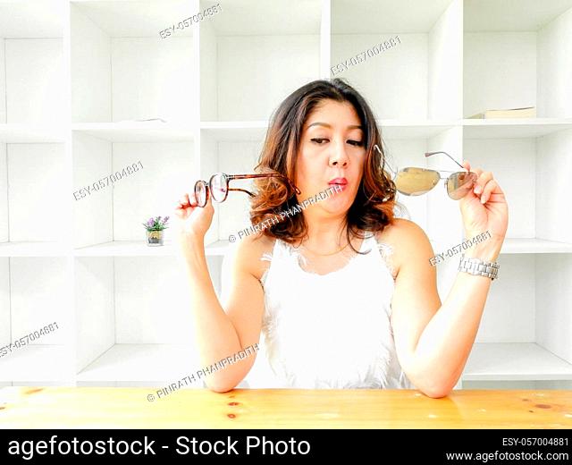 Beautiful Woman Covering Face Under Glasses