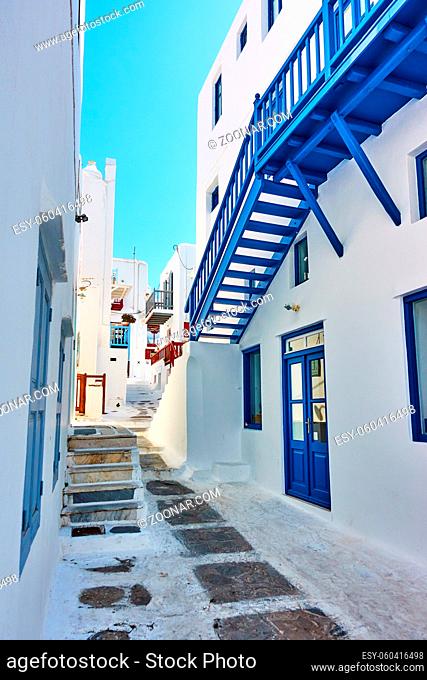 Street in Mykonos island in Greece on sunny summer day. Greek architecture, cityscape