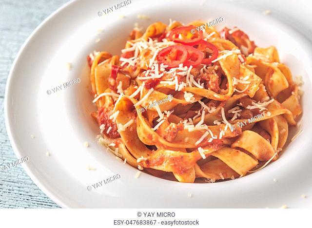 Portion of tagliatelle pasta with amatriciana sauce