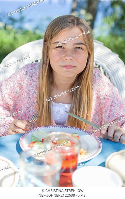 Portrait of girl having meal