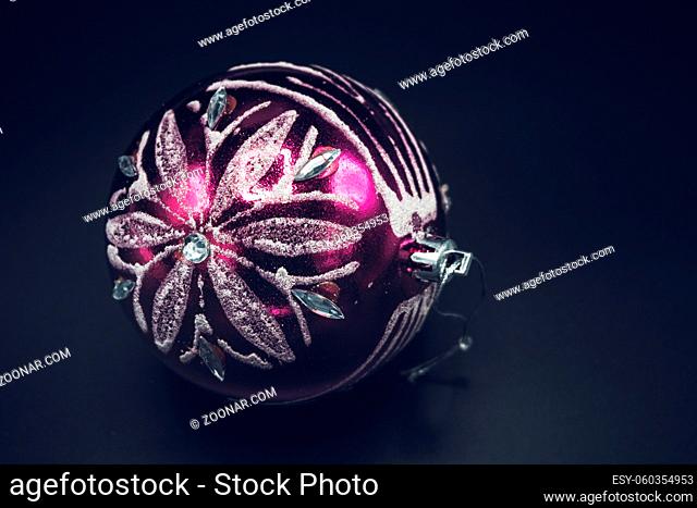 Christmas wallpaper background of pink and silver celebration tree ball isolated on black background