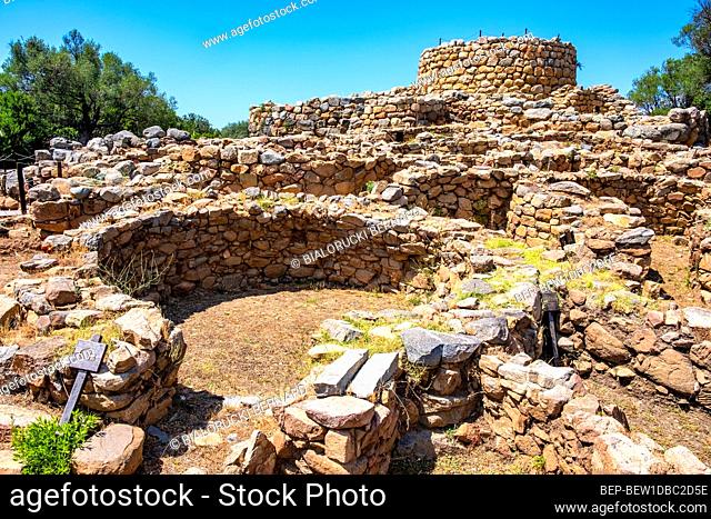 Arzachena, Sardinia / Italy - 2019/07/19: Archeological ruins of Nuragic complex La Prisgiona - Nuraghe La Prisgiona - with stone main tower and preserved...