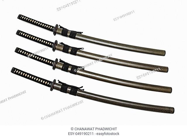 4 Japanese swords and green textured scabbard with black cord isolated in white background