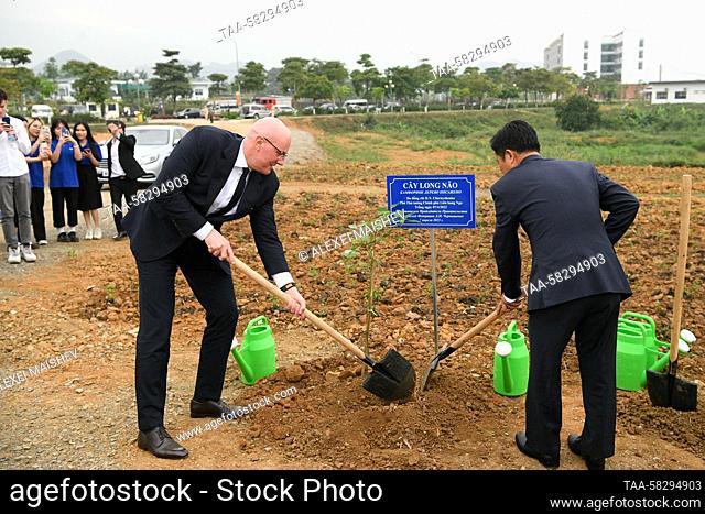 VIETNAM, HANOI - APRIL 7, 2023: Russian Deputy Prime Minister Dmitry Chernyshenko and Vietnam National University President Le Quan (L-R front) plant a camphor...