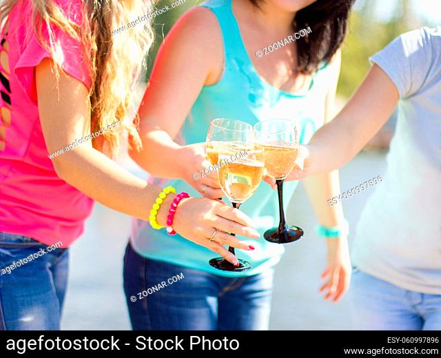 Girls having fun drinking champagne and celebrating a birthday or bachelorette party bride