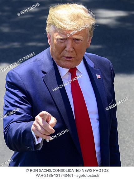 United States President Donald J. Trump answers reporter's questions prior to departing the South Lawn of the White House in Washington
