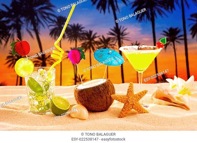 beach cocktail sunset on palm tree sand mojito margarita