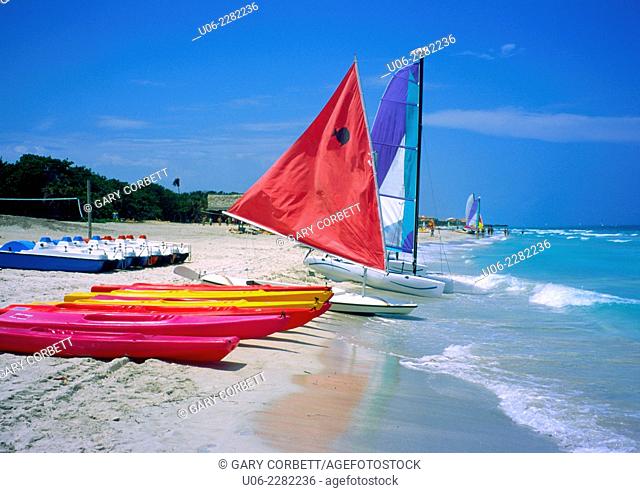 Varadero Beach at Varadero, Cuba showing sailboats and kayaks, sand and surf