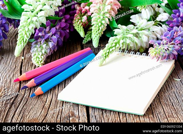 Purple beautiful lupines on wooden background