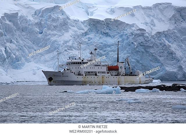 Antarctica, Expedition ship next to iceberg