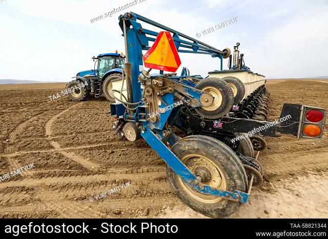 RUSSIA, PRIMORYE REGION - MAY 3, 2023: A sowing machine sows corn seeds in a field of the Mishin Mikhail Yuryevich farm in the Oktyabrsky District