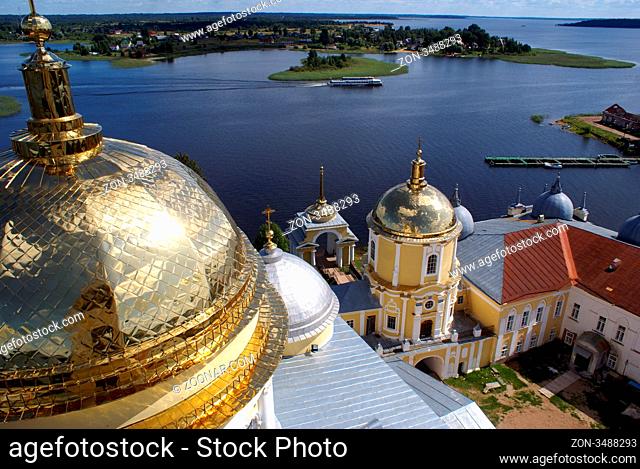 Golden cupola and lake Seliner in monastery Nolova Pustyn