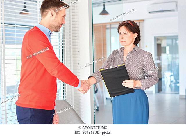 Man shaking hands at job interview