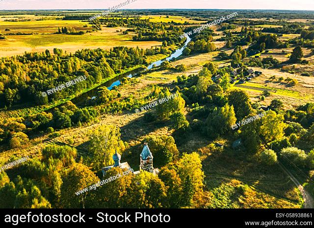 Martinovo, Beshenkovichsky District, Vitebsk Region, Belarus. Village Cityscape Skyline In Autumn Sunny Evening. Bird's-eye View Of Church Of The Intercession...