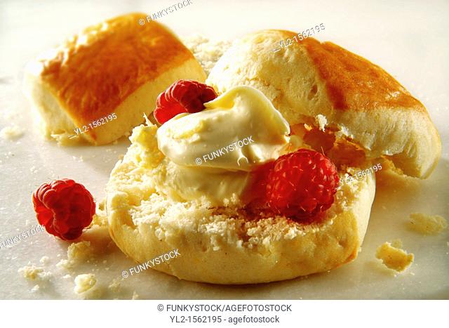 Traditional English scone with clotted cream and jam food photos