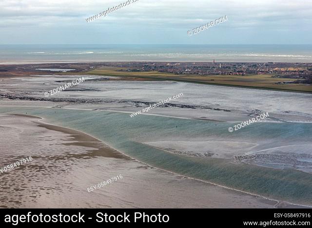 Aerial view Dutch island Schiermonnikoog with lighthouse sand low tide at waddensea