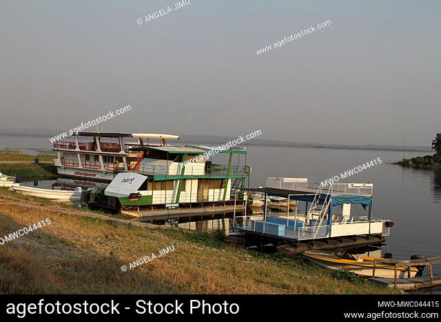 Boats are seen docked on the shores of the Zambezi river in Binga. Binga is in the Zambezi valley where the Zambnezi river runs through. Zimbabwe