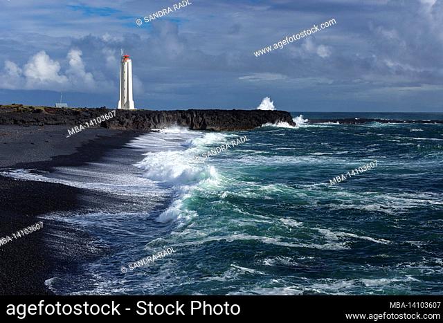 malarrif lighthouse, waves crash on black beach, snæfellsnes peninsula, iceland, west iceland