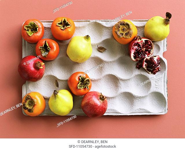 Various exotic fruits in a paper carton
