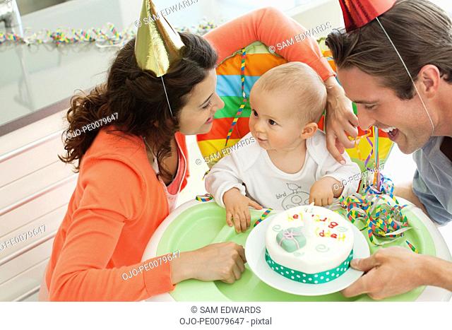 Parents celebrating baby’s first birthday